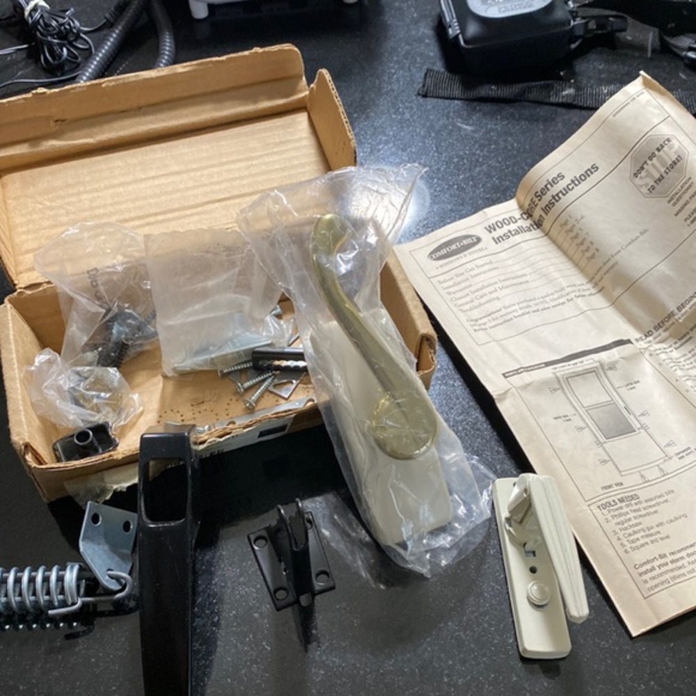 ReplacementHandle system for a Larson storm door in gold and ivory on th…